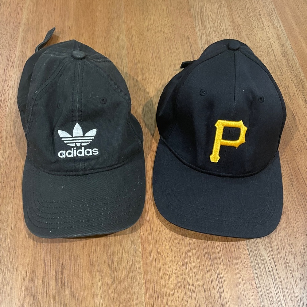 Black Adidas and Pittsburgh Pirates hats